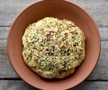 This recipe for garlic-thyme whole roasted cauliflower is simple to make and insanely delicious.